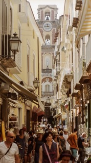A Mediterranean resort - A busy street packed with holidaymakers